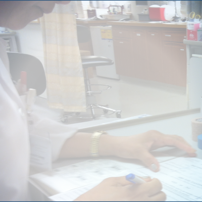 An image of a person working in a doctor's office